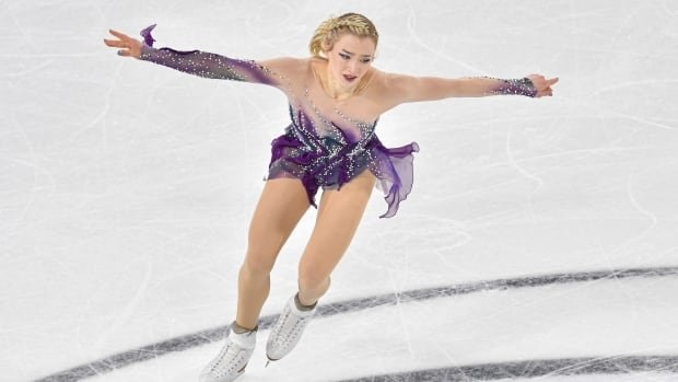 American Amber Glenn survives a fall to win her 1st Grand Prix figure skating title