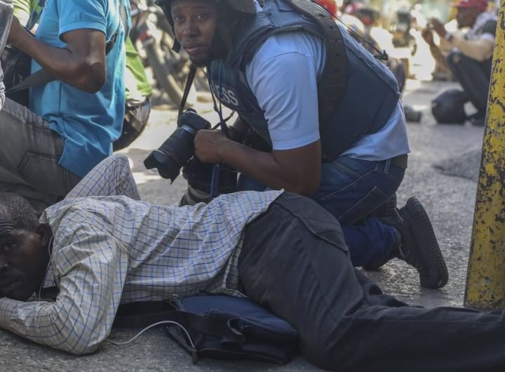 Haiti swears in a new prime minister as gangs open fire at a flight landing in the main airport