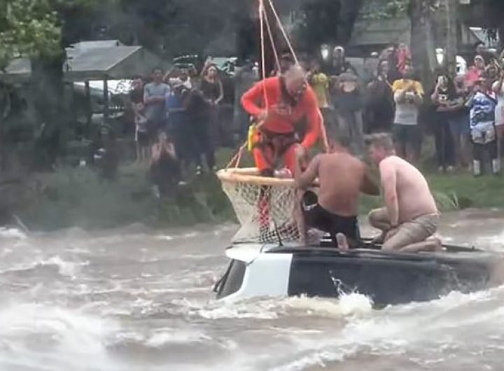 Helicopter rescuer saves two men from submerged car during horror floods