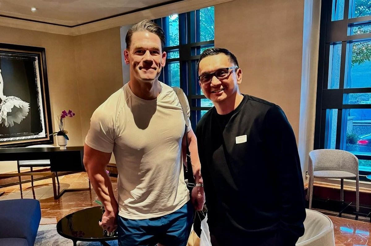 PBA legend and now Sacramento Kings coaching staff member Jimmy Alapag poses a photo with WWE legend John Cen