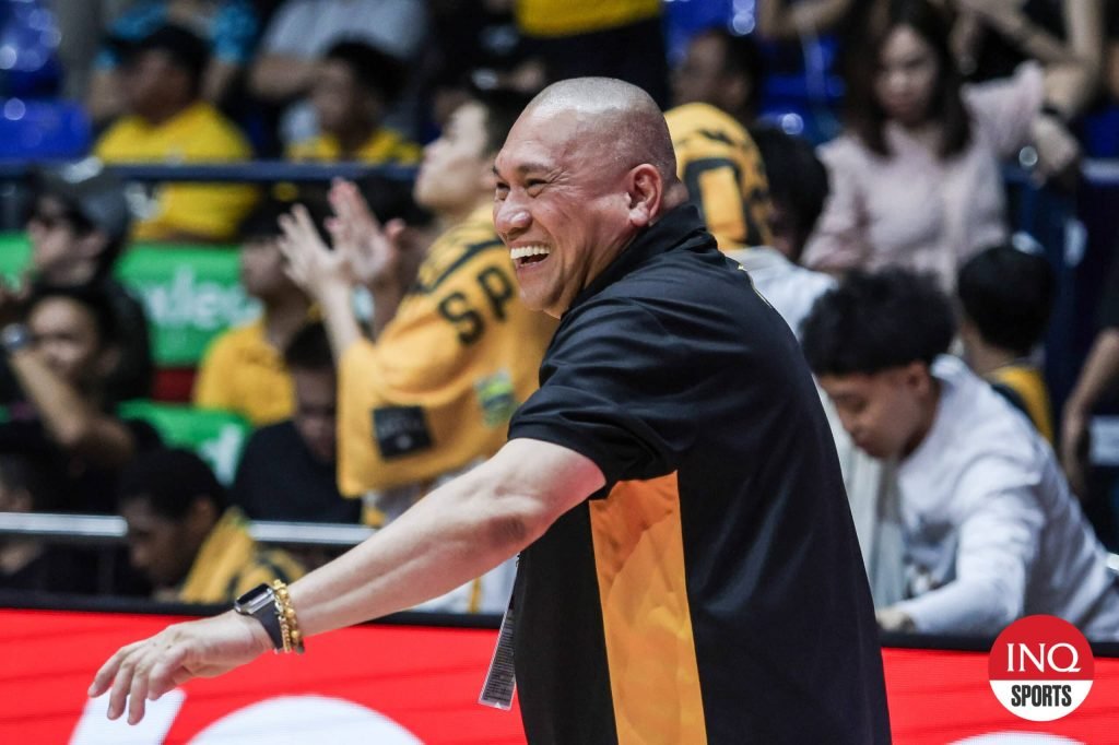 UST coach Pido Jarencio celebrates after Growling Tigers seal their return to the Final Four in the UAAP Season 87 men's basketball tournament.