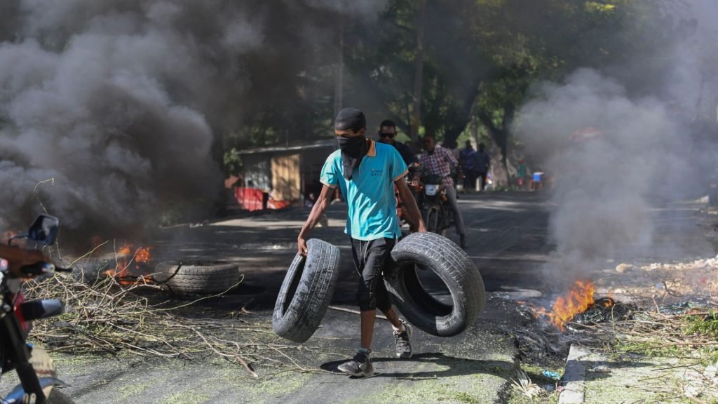 Vigilantes chop up mobsters & burn bodies in 'world's most dangerous city' after Haiti warlord 'Barbecue' vows coup