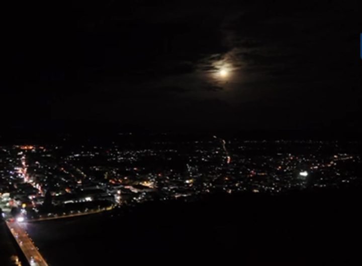 WATCH: After a series of consecutive storms battered the Philippines, the moon reappears over Laoag City, partially covered by clouds, offering a mome