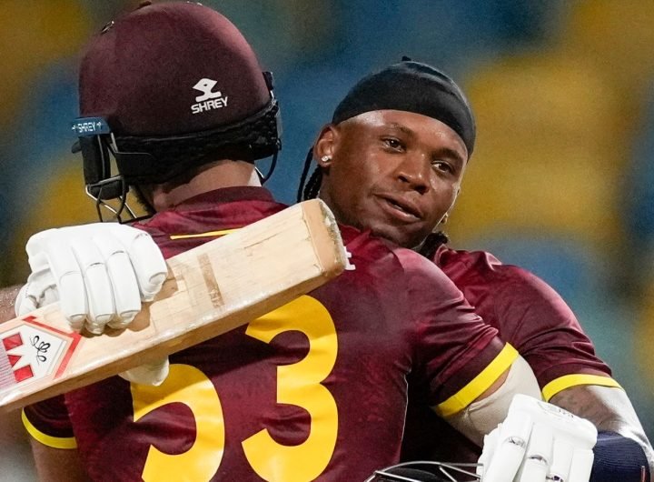 West Indies' Keacy Carty celebrates with teammate Brandon King scoring a century against England during the third ODI cricket match at Kensington Oval in Bridgetown, Barbados, Wednesday, Nov. 6, 2024. (AP Photo/Ricardo Mazalan)