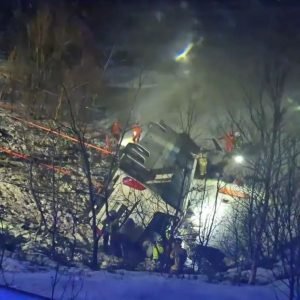 At least three killed & four seriously hurt after packed bus 'with tourists on board' plunges into lake in Norway