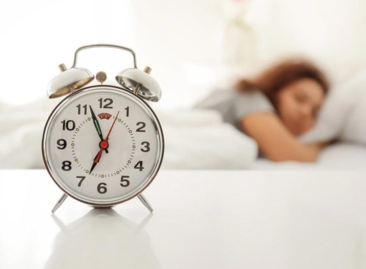 Alarm Clock Woman Sleeping in Bed