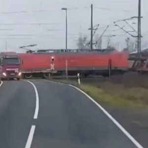 Dramatic moment freight train smashes into stranded truck at level-crossing SECONDS before driver escaped vehicle