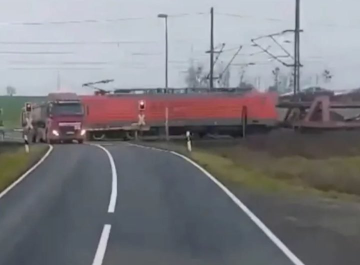 Dramatic moment freight train smashes into stranded truck at level-crossing SECONDS before driver escaped vehicle