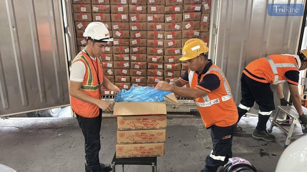 LOOK: Personnel from the Bureau of Customs unload and present the contents of the boxes inside the container vans recently turned over to the Departme