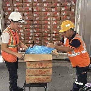 LOOK: Personnel from the Bureau of Customs unload and present the contents of the boxes inside the container vans recently turned over to the Departme