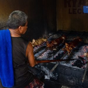 LOOK: Workers are busy roasting pigs, or lechon baboy, in La Loma, Quezon City on Monday, just two days before Christmas.