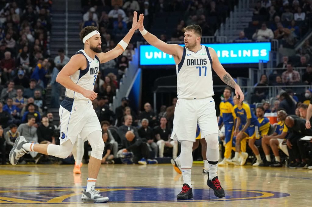 Dallas Mavericks guard Klay Thompson (left) is congratulated by guard Luka Doncic NBA