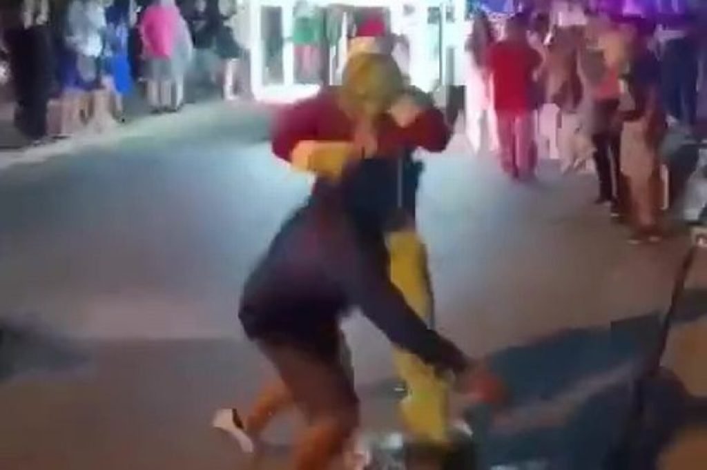 Moment cop dressed as Grinch punches reveller at parade after his colleague is teased