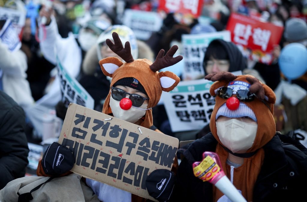 Protesters participate in a rally calling for the impeachment of South Korean President Yoon Suk-yeol in front of the National Assembly in Seoul, Sout