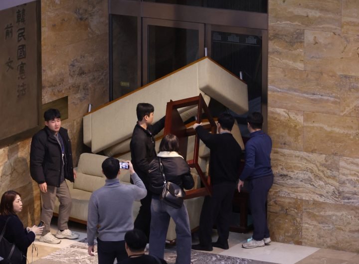 South Korea's main opposition Democratic Party's staff set up a barricade to block soldiers at the National Assembly in Seoul, South Korea, after Sout