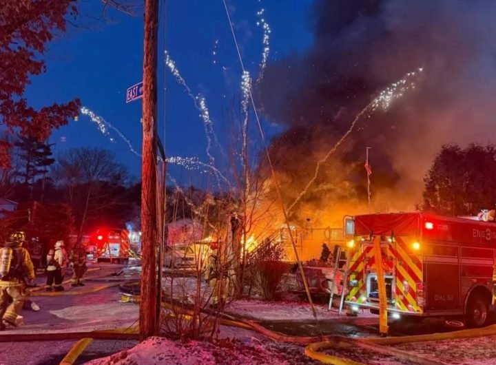 Terrifying moment barrage of fireworks launch from huge house blaze as firefighters battle inferno