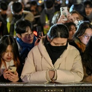 Watch haunting moment mourning South Korea marks New Year with SILENT crowds after plane disaster and ‘coup’ drama