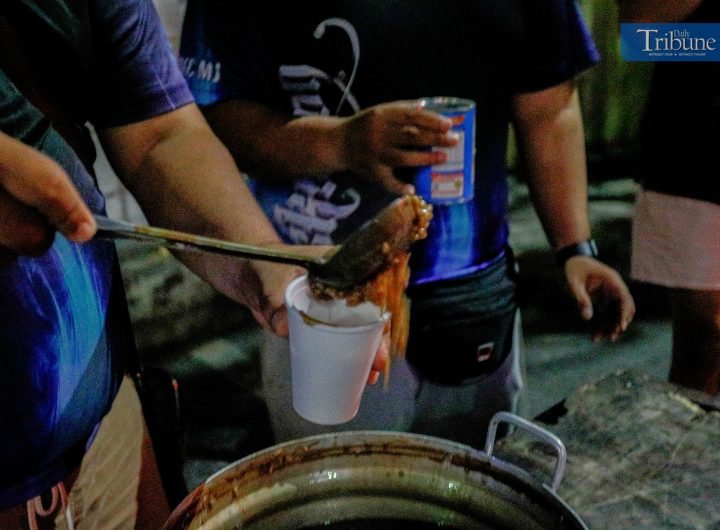 Youth volunteers prepared and offered hot champorado to attendees of the first morning of misa de gallo at The Cubao Cathedral, Quezon City on Monday,