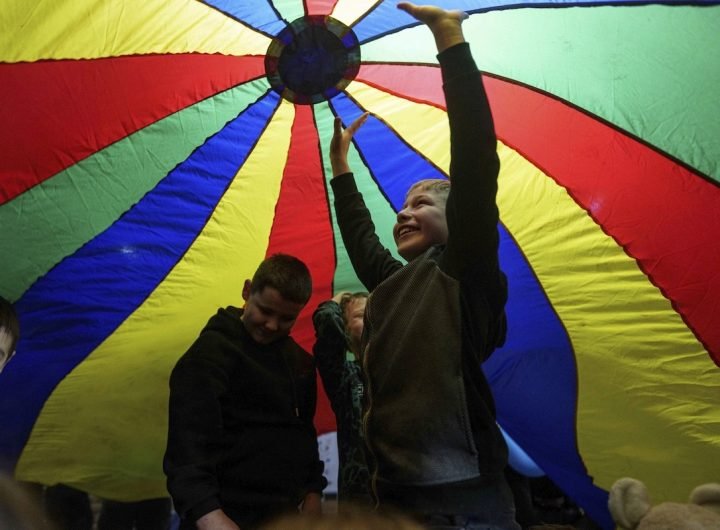 PHOTO: Ukrainian children under a play parachute