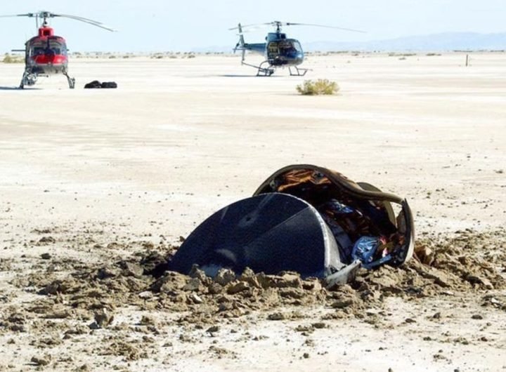 a smashed metal cylinder embedded into the desert floor