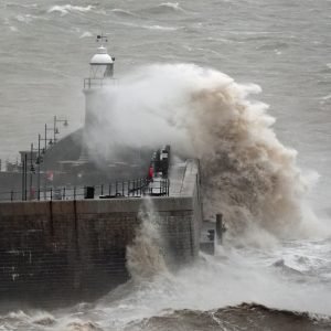 Britain sees in the New Year with heavy downpours with snow expected this weekend