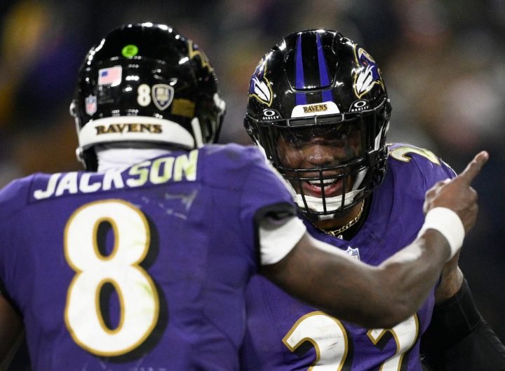 Baltimore Ravens running back Derrick Henry (22) is congratulated by teammate Lamar Jackson (8) after scoring during the second half of an NFL football game against the Cleveland Browns Saturday, Jan. 4, 2025, in Baltimore. (AP Photo/Nick Wass)