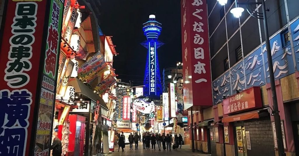 Fire engulfs commercial building near Osaka's Tsutenkaku Tower, smoke fills the skyline