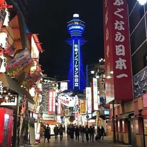 Fire engulfs commercial building near Osaka's Tsutenkaku Tower, smoke fills the skyline