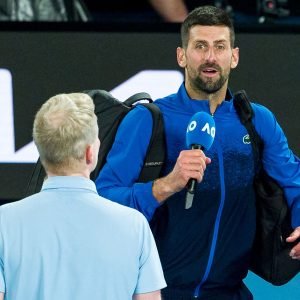 Novak Djokovic of Serbia speaks to the crowd following victory against Jiri Lehecka of the Czech Republic in the Men's Singles Fourth Round match during day eight of the 2025 Australian Open at Melbourne Park on January 19, 2025 in Melbourne, Australia. (Photo by Andy Cheung/Getty Images)