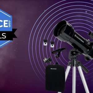 The Celestron Travel Scope 70 with it's accessories in black, on a purple background with disco rings while the space.com logo is in the top left corner