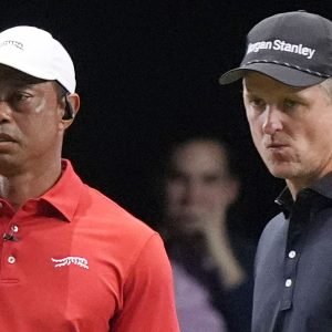 Tiger Woods of the Jupiter Links Golf Club watches his shot on the 10 green as Justin Rose of the Los Angeles Golf Club prepared to line his putt, Tuesday, Jan. 14, 2025, in Palm Beach Gardens, Fla. (AP Photo/Marta  Lavandier)