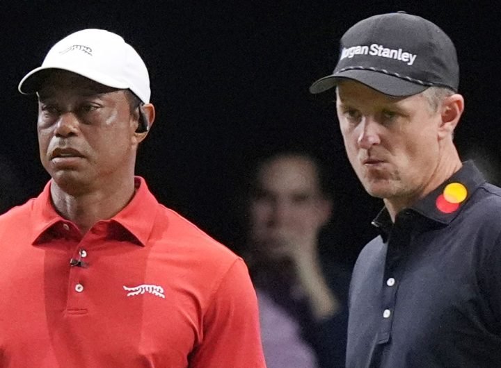 Tiger Woods of the Jupiter Links Golf Club watches his shot on the 10 green as Justin Rose of the Los Angeles Golf Club prepared to line his putt, Tuesday, Jan. 14, 2025, in Palm Beach Gardens, Fla. (AP Photo/Marta  Lavandier)