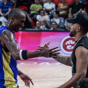 TNT import Rondae Hollis Jefferson and former star Mikey Williams exchange greetings during a PBA Commissioner's Cup game.