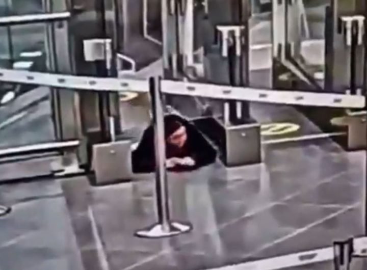 Watch moment woman crawls under airport security barrier before sneaking onto PLANE completely unnoticed