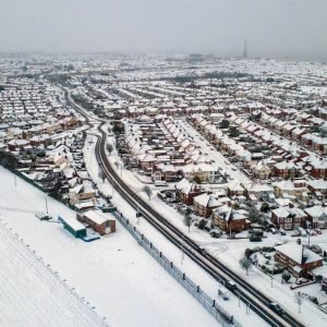 Weather tracker live: Flights delayed and roads closed as snow hits UK while Met Office issues new warning